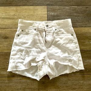 White ripped jean shorts